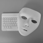 Laptop Keyboard and Anonymous Mask. Data Thief, Internet Fraud, Cyberattack, Cyber Security Concept.