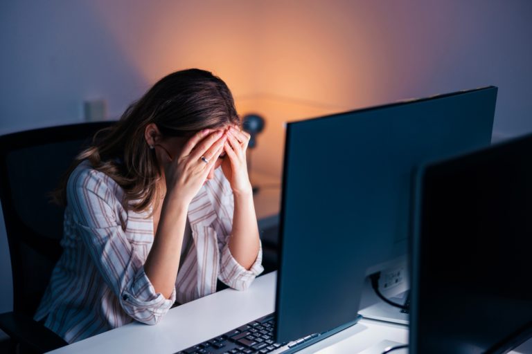 Stressed out Woman Working Late in an Office