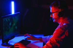 Professional Gamer Plays Video Game on His Computer. He's Participating in Online Cyber Games